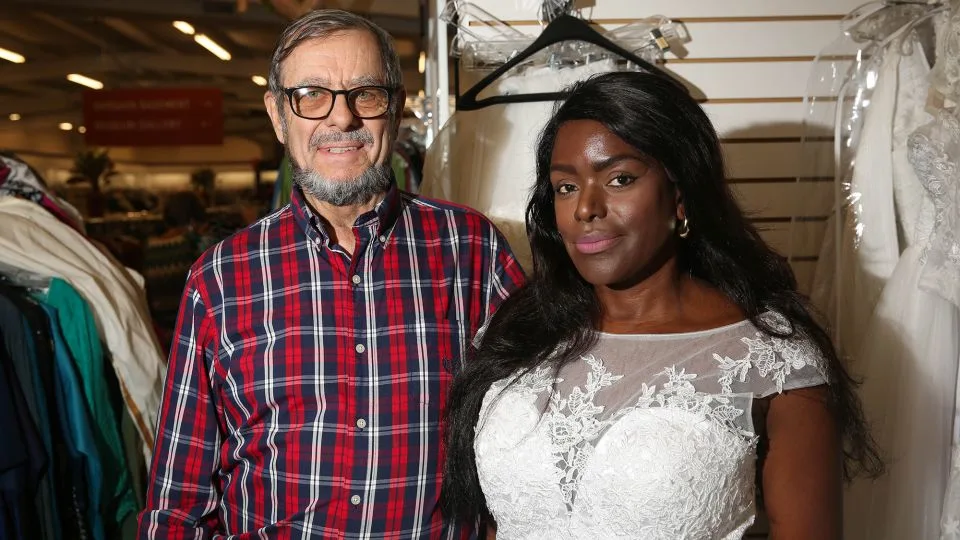 Vee Aronds, 55, right, and Frederick Stewart, 75, shop at Unclaimed Baggage, where Aronds tried on a wedding dress. - Austin Steele/CNN
