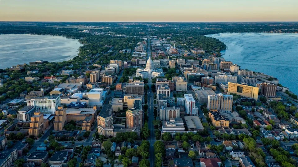 Aerial view of Madison city downtown, urban grid with capitol building between two lakes, sunset light, Wisconsin