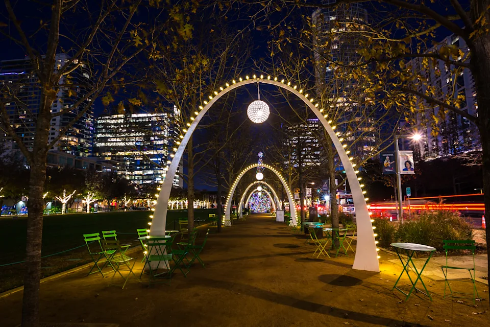 Dallas, Texas, USA - December 23rd, 2021: Illuminated decorative arches and lights in the Klyde Warren Park in the downtown