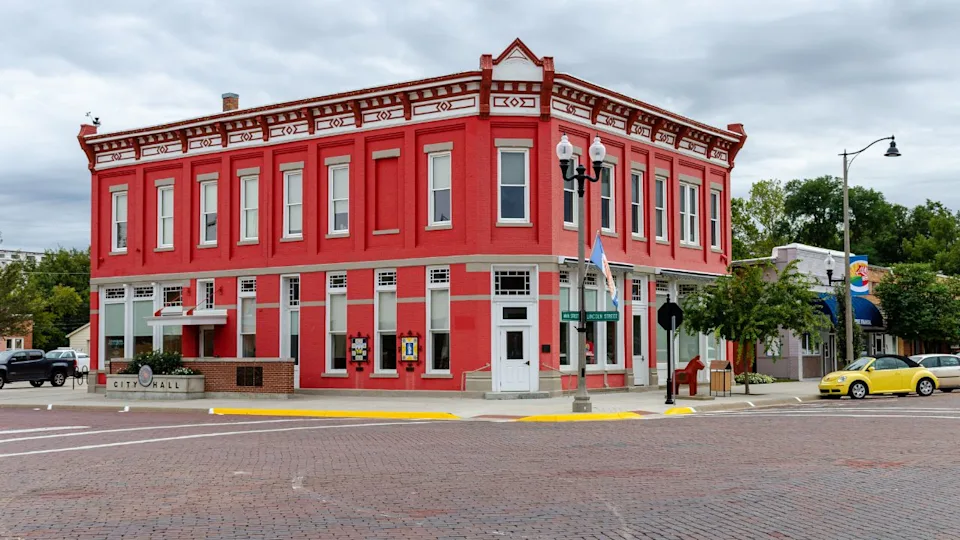October, 2019, Lindsborg, Kansas, USA - The original Farmers State Bank building in Lindsborg, Kansas, is now home to City Hall and sports a bright red coat of paint. 
