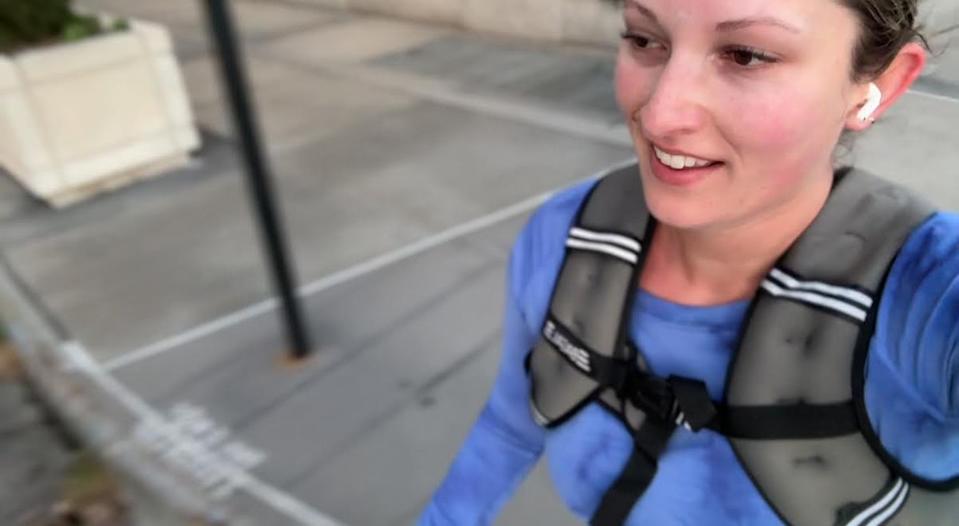 Musto runs down Riverside Drive in Manhattan wearing a weighted vest (Julia Musto/The Independent)