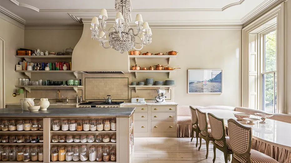 The kitchen features a breakfast nook and plenty of windows to bring in outside light