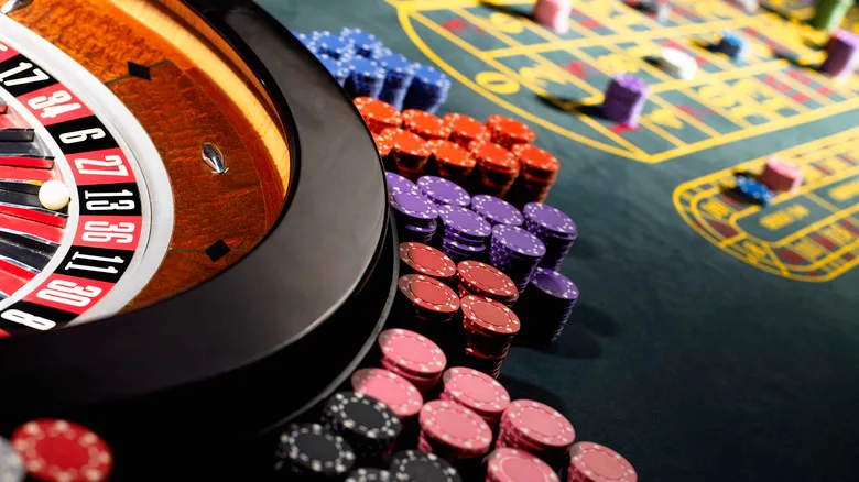 A close-up of a roulette wheel in a casino