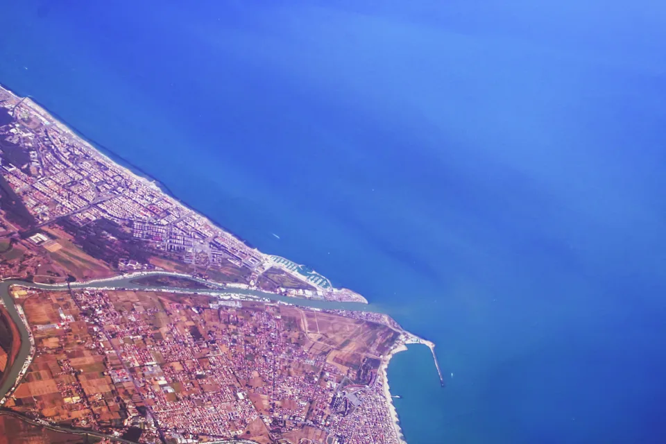 Aerial view from the window of a commercial flight of Isola Sacra. This small coastal region just south of Rome is facing development of a cruise port that will welcome mega ships Ð which residents have been advocating against since 2010, according to Fodor's. Its construction could possibly destroy a protected natural area just 1,000 feet away, some environmental experts and advocates say.