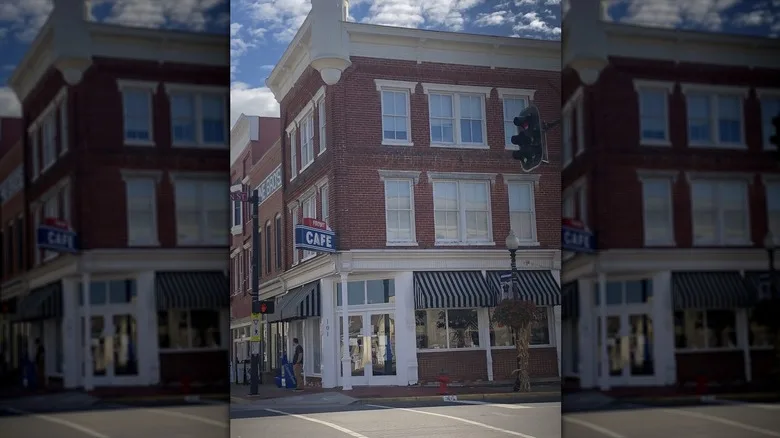Exterior of Frost Cafe in a red brick building on a street corner