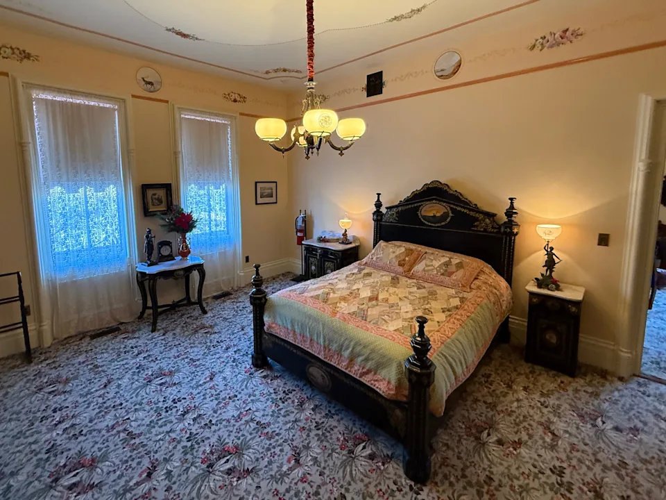 A bedroom inside a mansion