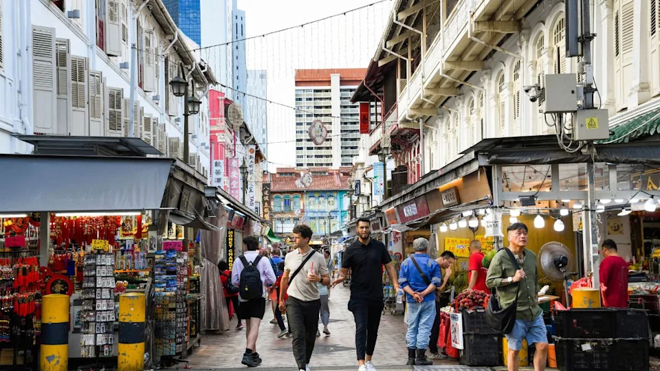 Singapore- July 11, 2024: Tourists visit the historic shophouses in Chinatown Street Market, Singapore, Kreta Ayer is home to an assortment of traditional trades and some of the best hawker food.