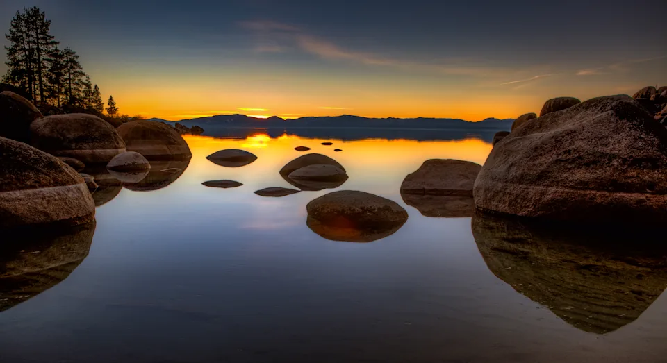A view across Lake Tahoe from Sand Harbor at sunset