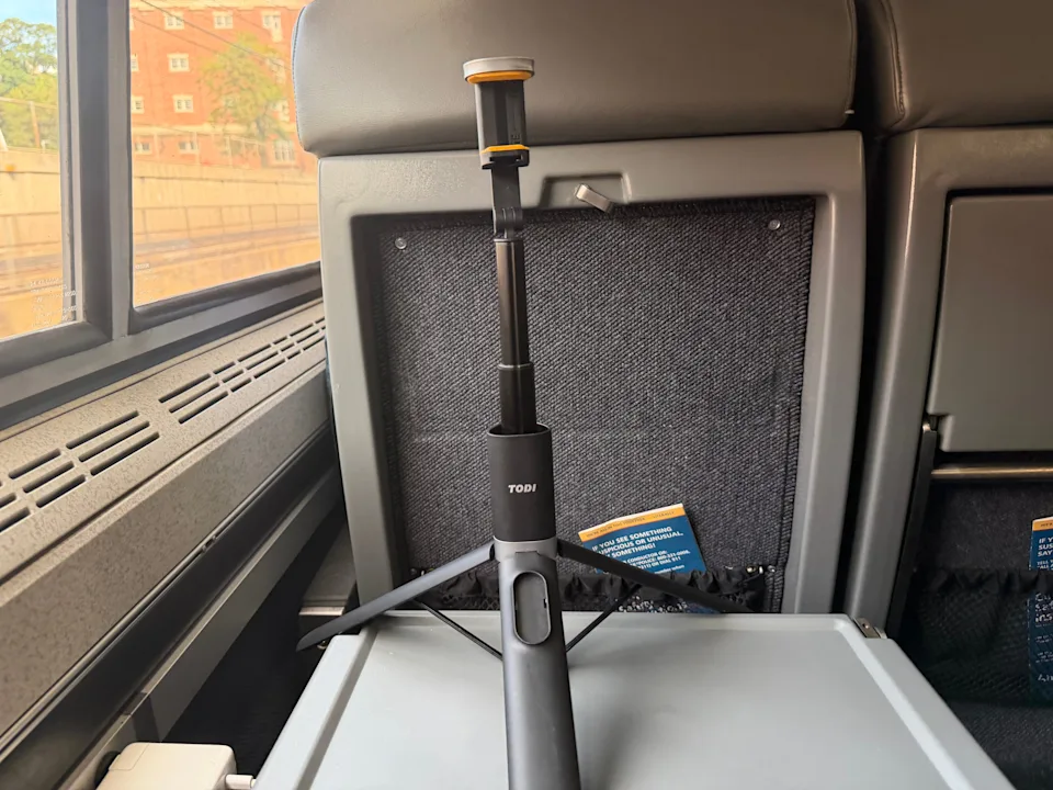 A tripod on an Amtrak tray table.