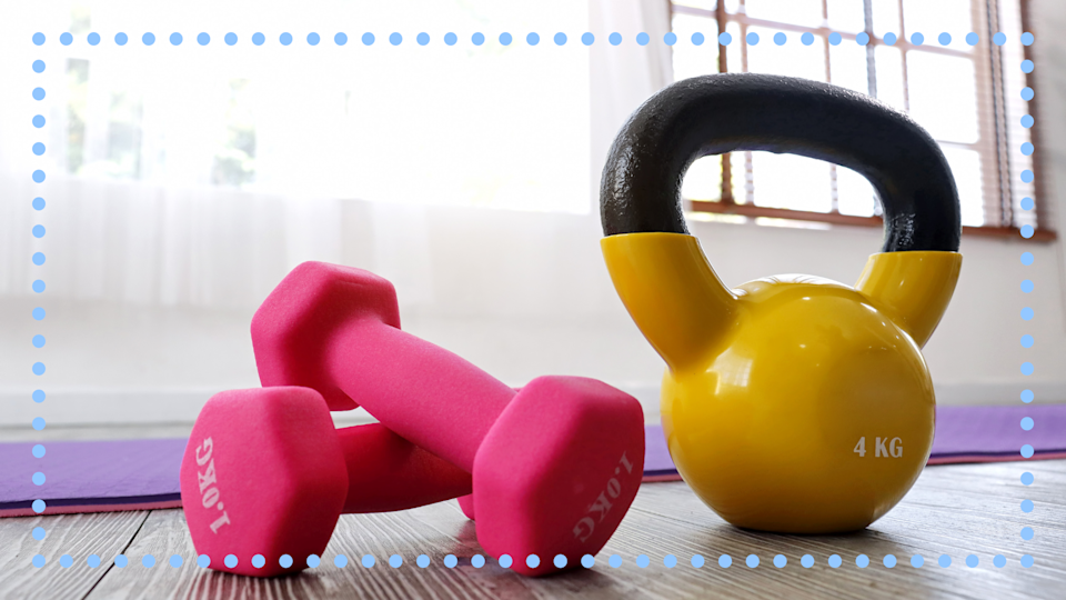 Dumbbells and a kettlebell on a floor. 