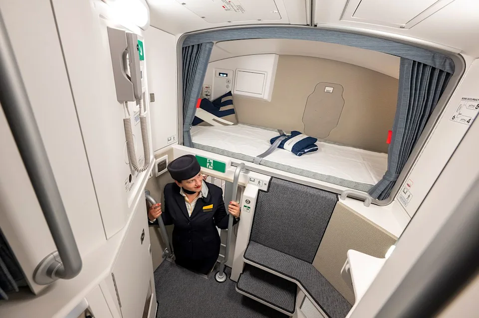 Peter Kneffel/Getty Images A Lufthansa cabin crew member stands in the rest and sleeping area for the cabin crew of an Airbus A350-900.