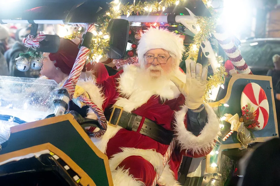 Alexandra Wardwell/Montana Department of Commerce Santa Claus waves during Bigfork's annual Parade of Lights.