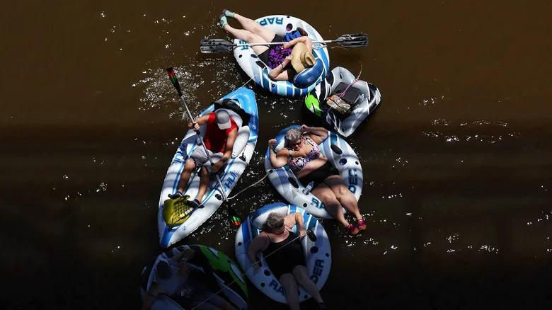 People floating down the Colorado River in tubes in Yuma, Arizona