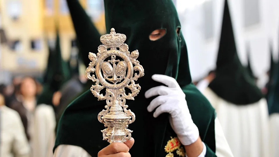 Procession of Holy Week (Semana Santa) in Seville. Nazarenes of the brotherhood of the Our Lady of Hope (Esperanza) of Triana.