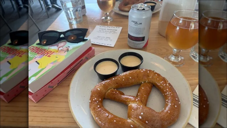 Large pretzel and a can of beer