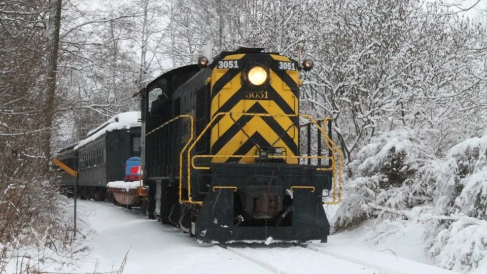 Christmas lights, garland, and ornaments decorate the Cooperstown & Charlotte Valley Railroad during the holiday season.