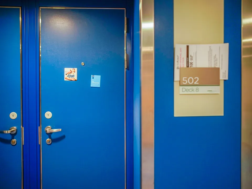 A magnet on the blue door to the author's cabin