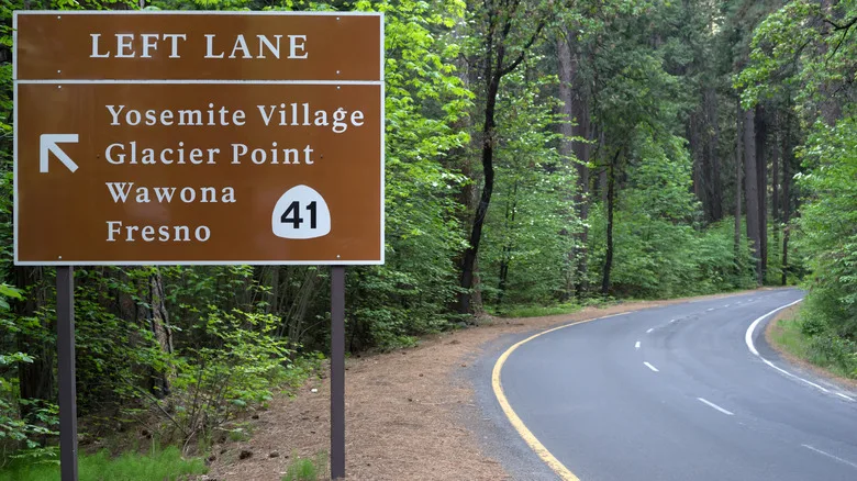 A sign marks the entrance to Yosemite that leads to Wawona Campground