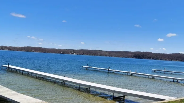 Docks in lake with sandy bottom