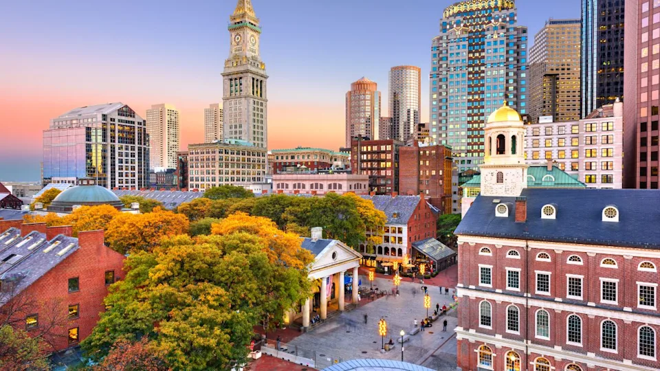 Boston, Massachusetts, USA skyline with Faneuil Hall and Quincy Market at dusk.