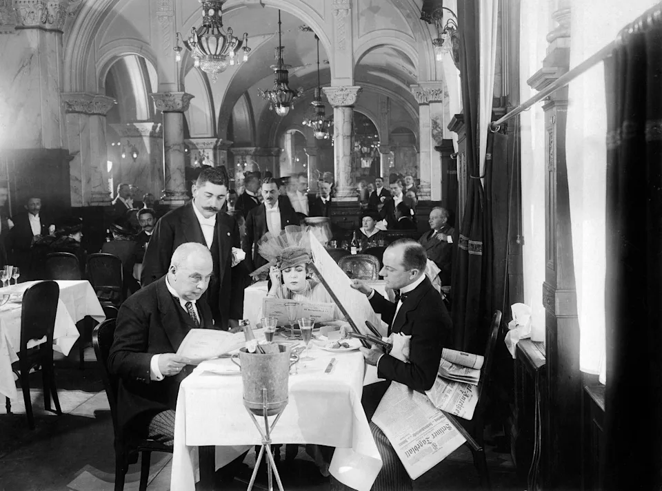 Diners in a formal restaurant setting.
