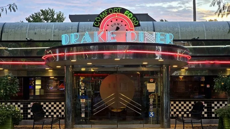 Front entrance of Drake Diner with its blue and red neon sign