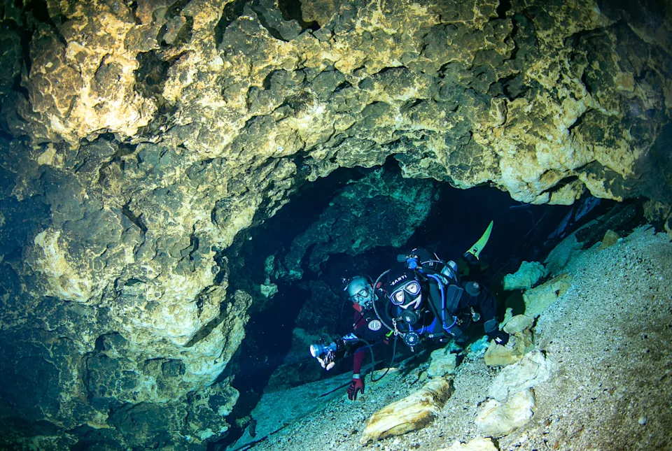 Joe Wallace, left, and Taylor Schott explore the cavern at Blue Hole at Ichetucknee Springs State Park on Oct. 22 in Fort White. Blue Hole offers a lovely swim and exciting dive for those with the right training.