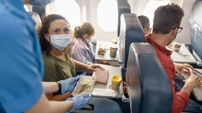 Passengers wearing face masks while flying