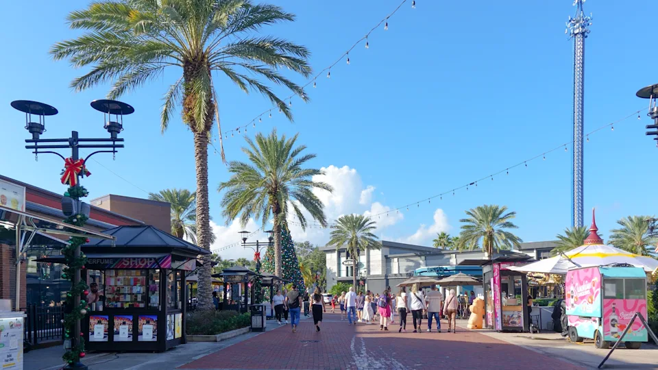 Orlando FL, United States - December 31, 2024: Icon Park in Orlando features palm trees and colorful shops, creating a vibrant and lively atmosphere for visitors