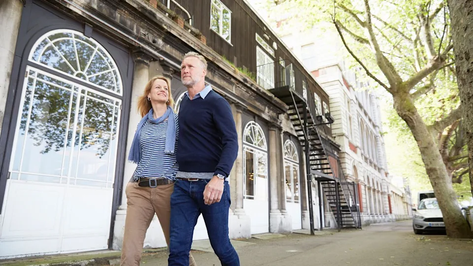 Couple walking down street together
