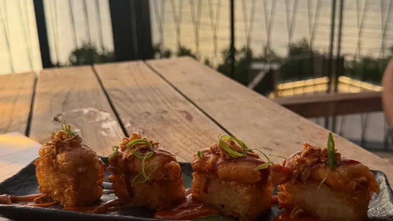 a meal at Wellina with the sunset in the background