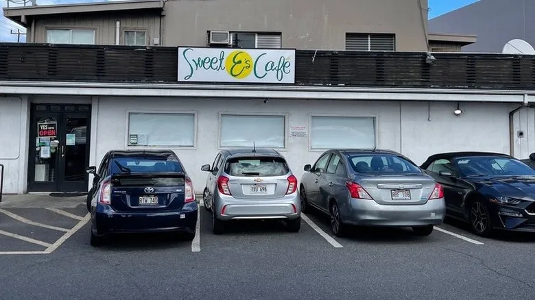 The exterior of Sweet E's Cafe with cars parked outside