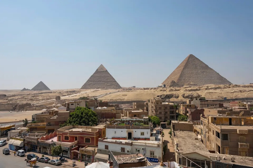 September 2021 - Giza, Egypt - The Great Pyramids next to Cairo city