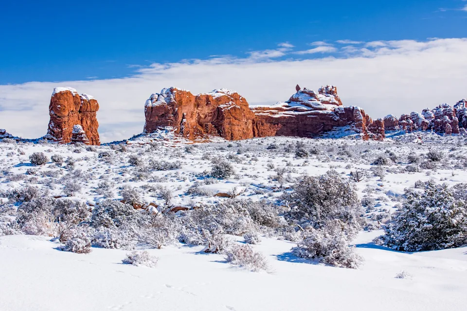 Ham Rock atop Ham Rock Butte after a winter snow in Arches National Park, Moab, Utah.