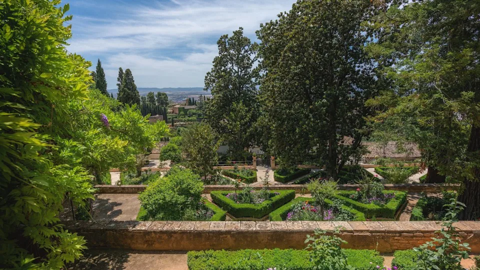 Granada, Spain - May 24, 2019: High Gardens at Generalife Gardens of Alhambra - Granada, Andalusia, Spain