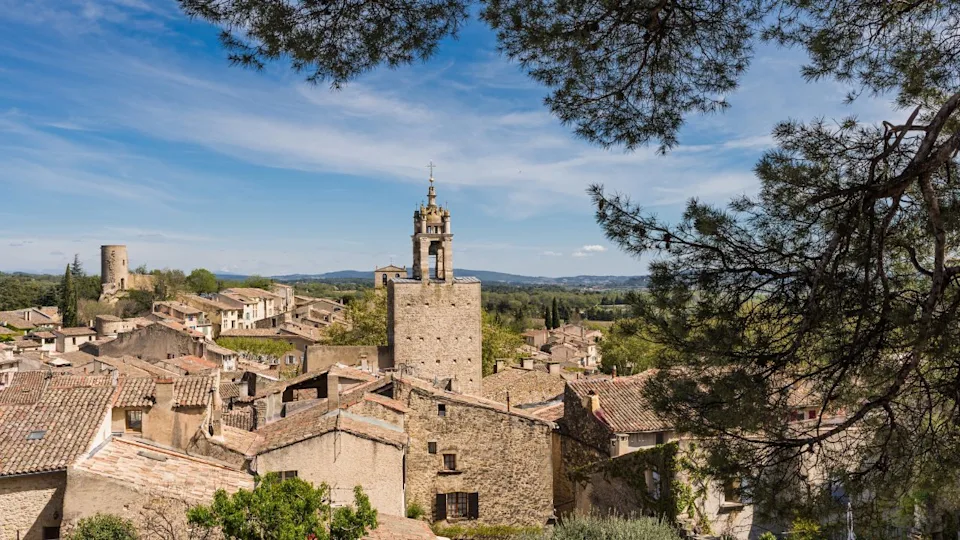 Cucuron, France - April 2022 : Clock tower of the village of Cucuron in the Luberon valley in Provence, France