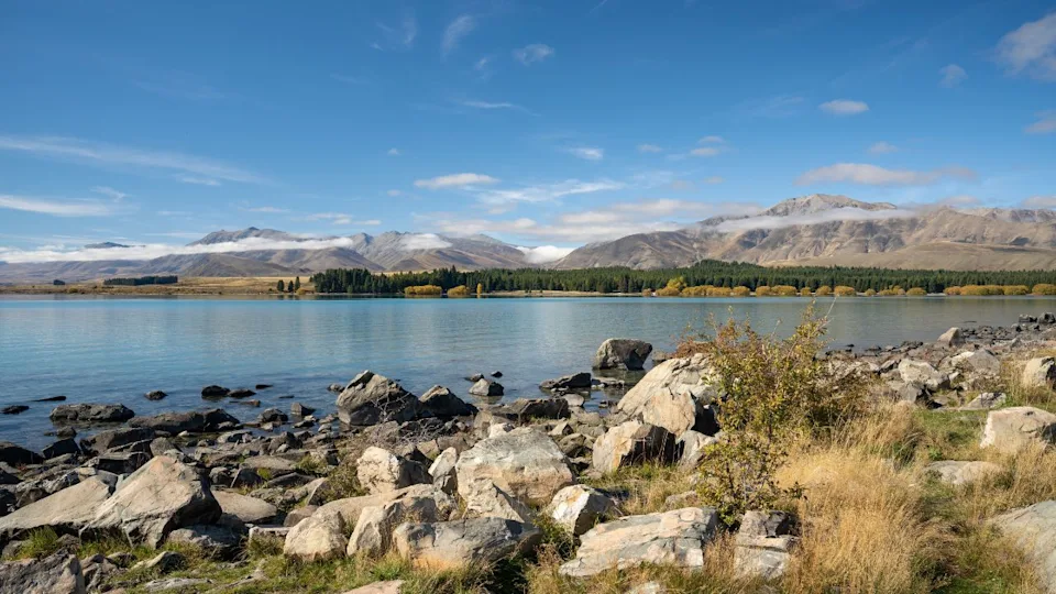 A beautiful shot of mountains across the shore of Lake Tekapo in New Zealand