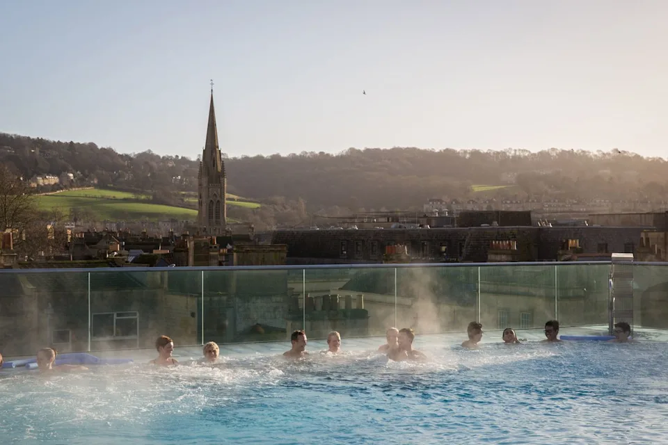 Matt Cardy/Getty Images Bathers at the Thermae Bath Spa, a natural thermal spa in the town of Bath.