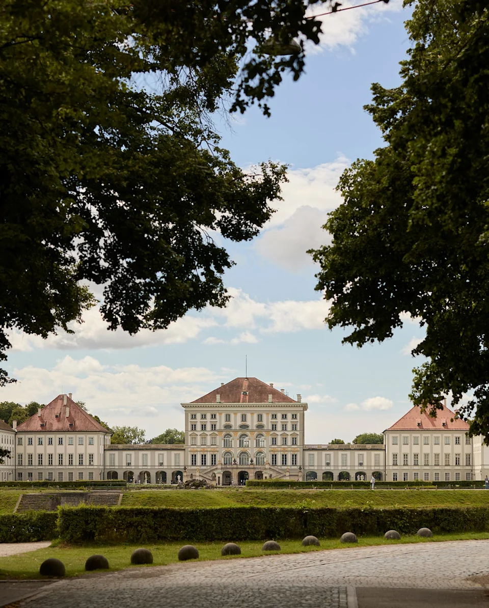Nymphenburg Palace in Munich Historic palace surrounded by greenery and pathways.