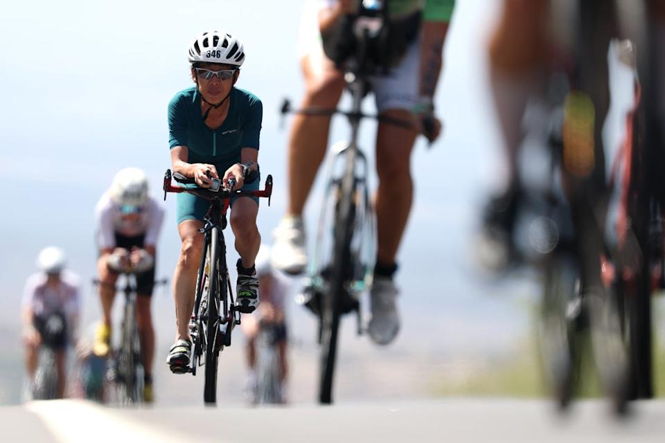 Participants compete in the 2025 IRONMAN World Championship Women's Race in October in Kailua Kona, Hawaii. Cycling is a good way for runners to get their heart rate up while taking a break from running (Getty Images for IRONMAN)