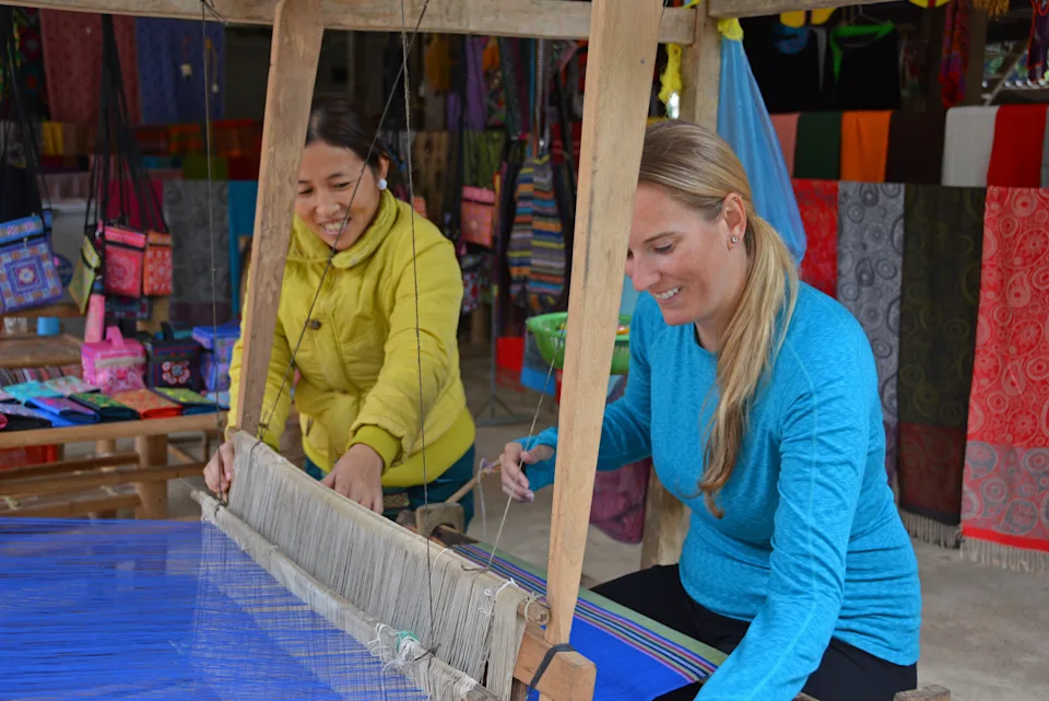 Two women doing crafts in Mai Chau Village, Vietnam.