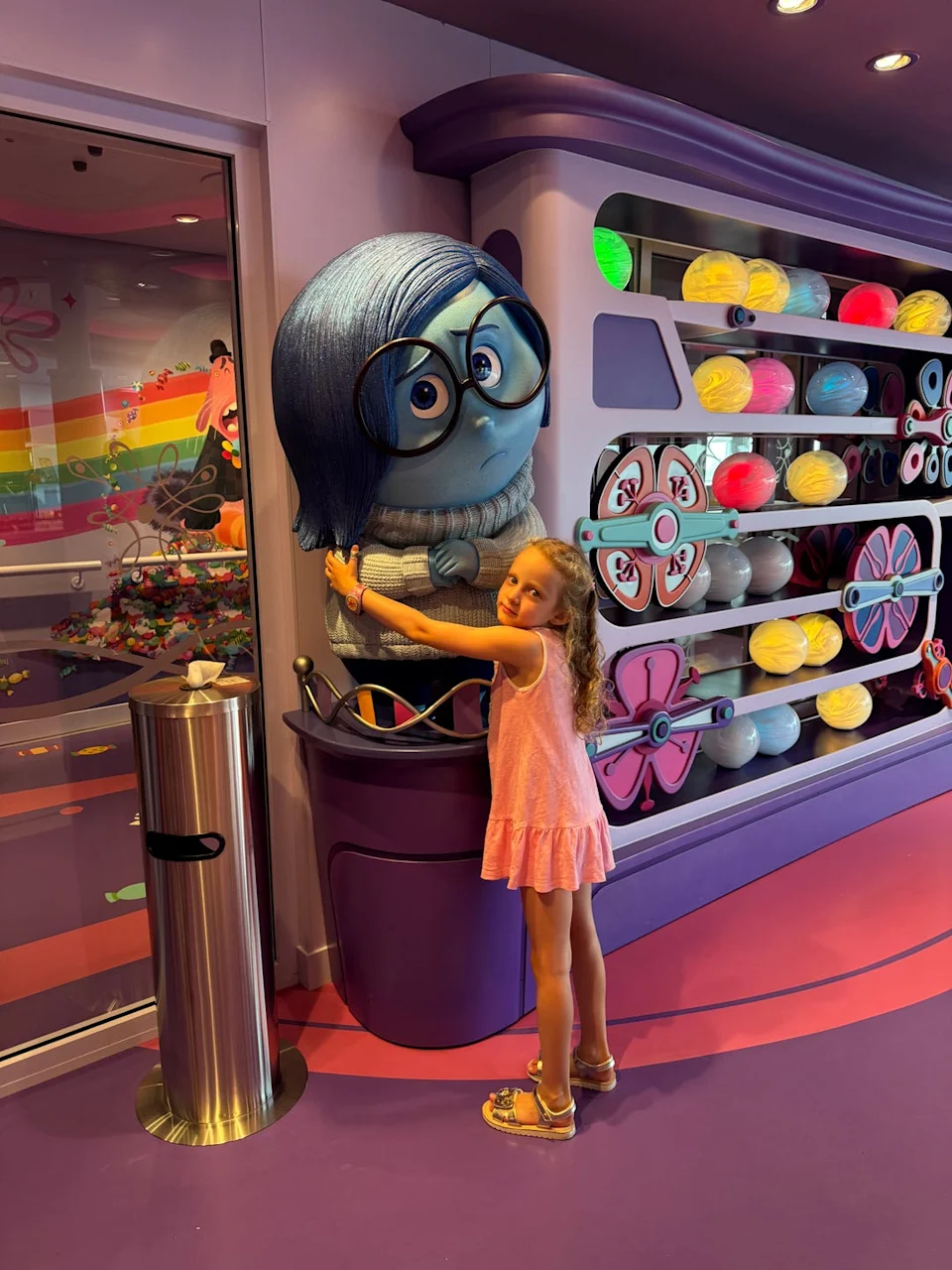 a child hugging a statue