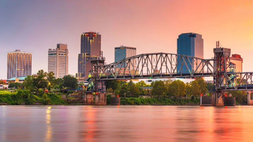 Little Rock, Arkansas, USA skyline on the river at twilight.