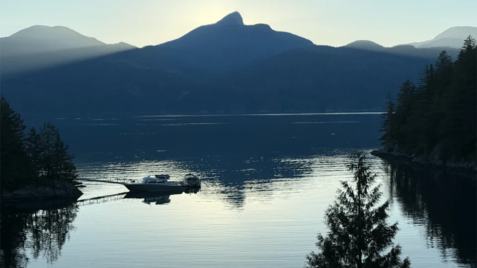 View of inlet and mountains from the porch of Fawn Bluff lodge