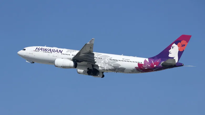 A Hawaiian Airlines passenger plane flying in the sky
