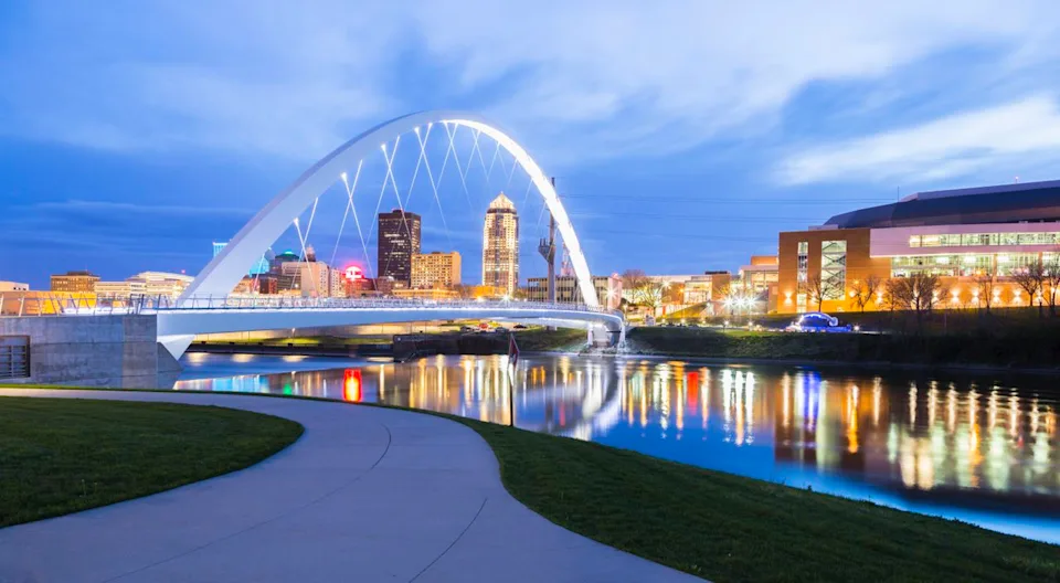 Eddie Brady / Getty Images A pedestrian bridge spans the Des Moines River in Iowa's capital—a city that feels like a small town but punches above its weight in amenities.