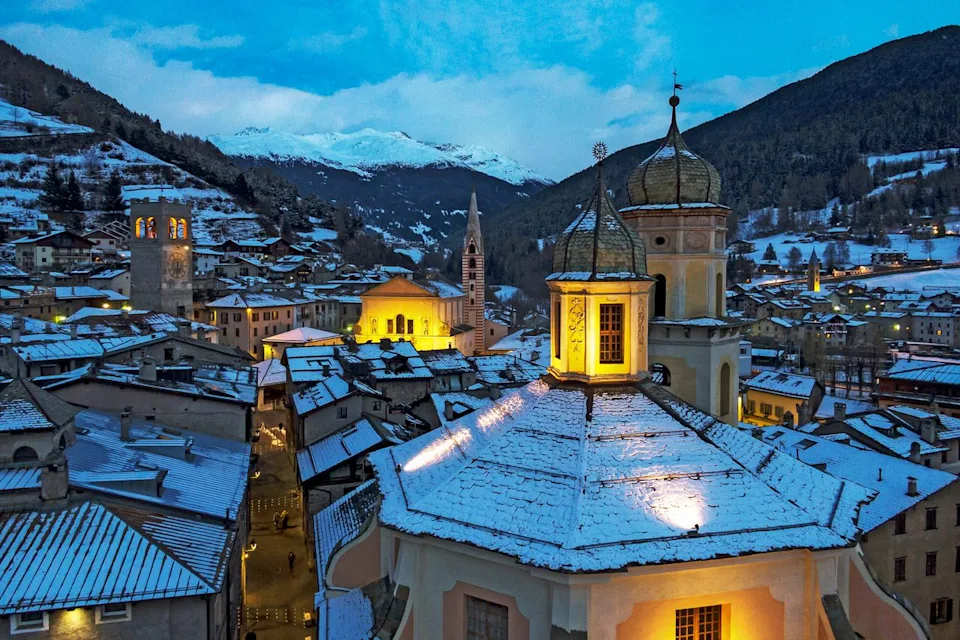 Bormio Tourism Buildings lit at night in Bormio.