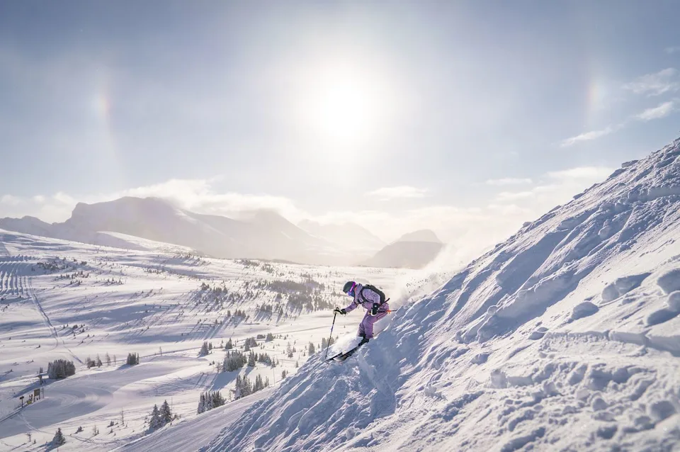 Jill Tester/Courtesy of Banff & Lake Louise Tourism A skier going down a mountain at Sunshine Village.
