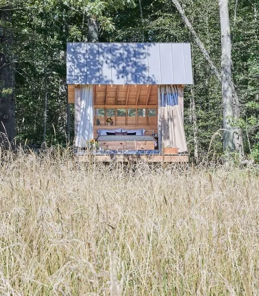 A multi-layer curtain system provides privacy—with nets to keep mosquitos out—but according to Matt and Kelsey, leaving it open and falling asleep with the stars bright overhead is a dreamy experience.