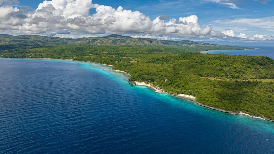 Birds eye view shot of Paradise looks of Siquijor Island under the clear blue skies. Siquijor, Philippines.
